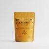 A professional product photo of the Kathait Gold Turmeric Powder sealed pouch on a clean white background, showcasing the brand's clear and elegant packaging.