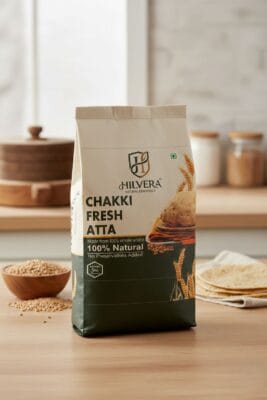Front Packaging Design Of Hilvera Chakki Fresh Atta Highlighting 100% Natural, Preservative-Free Whole Wheat Flour For Soft Rotis.