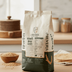 Hilvera Chakki Fresh Atta 5Kg Paper Bag Packaging By Upfront Enterprise, Featuring Nutritional Facts, Fssai Logo, And Natural Whole Wheat Grains In A Kitchen Setting.