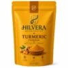 Hilvera Natural Essentials Turmeric Powder, 100% pure turmeric spice in resealable pouch with turmeric roots and powder, high-quality cooking ingredient.