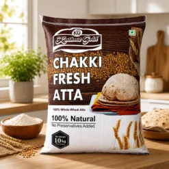 Kathait Gold 100% natural whole wheat flour packaging. Premium Chakki Fresh Atta 10kg bag on a kitchen counter, showcasing healthy, preservative-free ingredients for everyday Indian cooking.